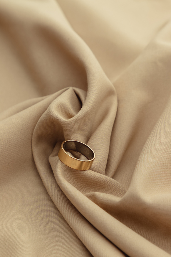 Gold Ring on Brown Satin Cloth